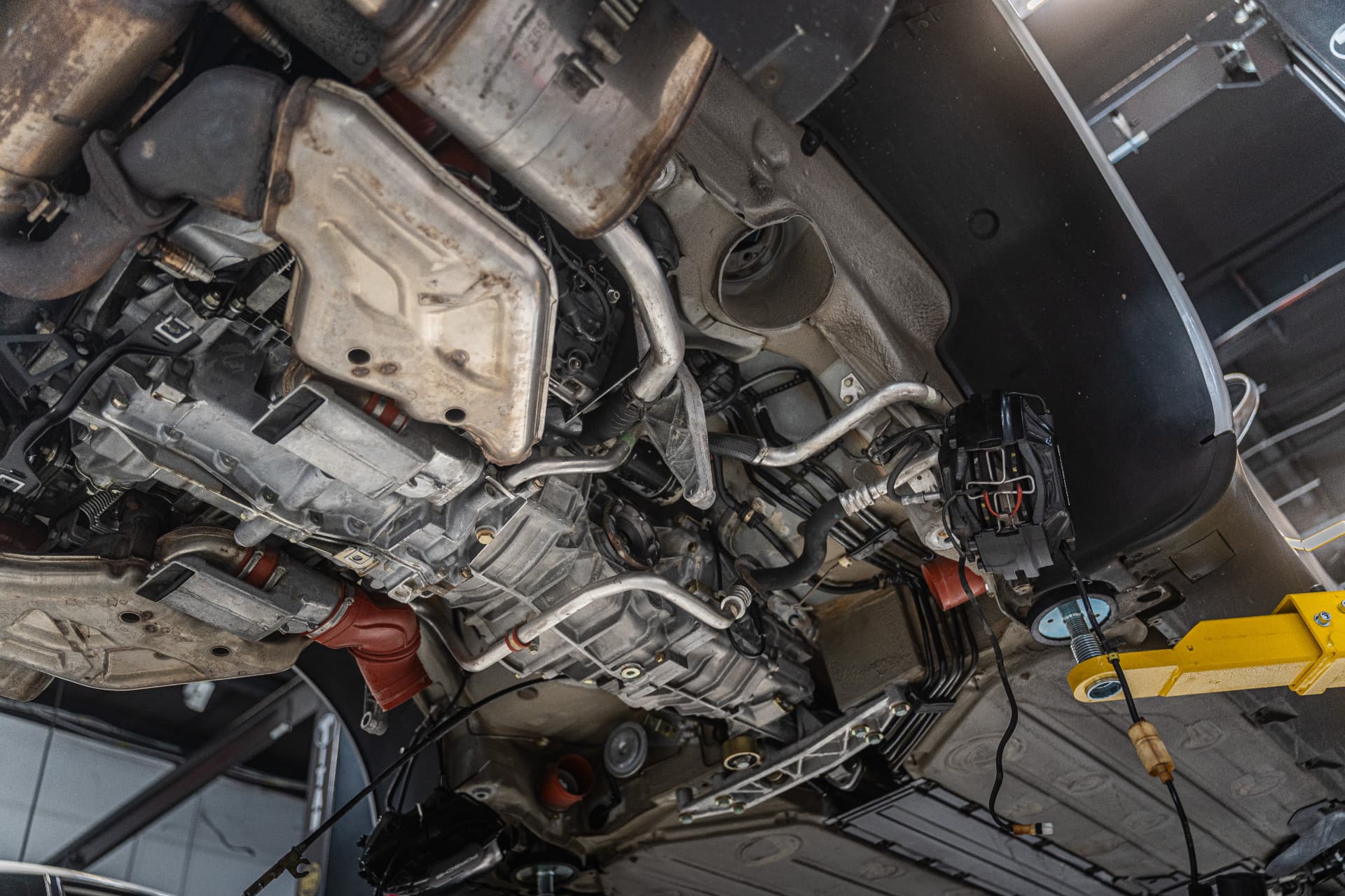 Undercarriage inspection during a pre-purchase inspection at Velocity Motorcars